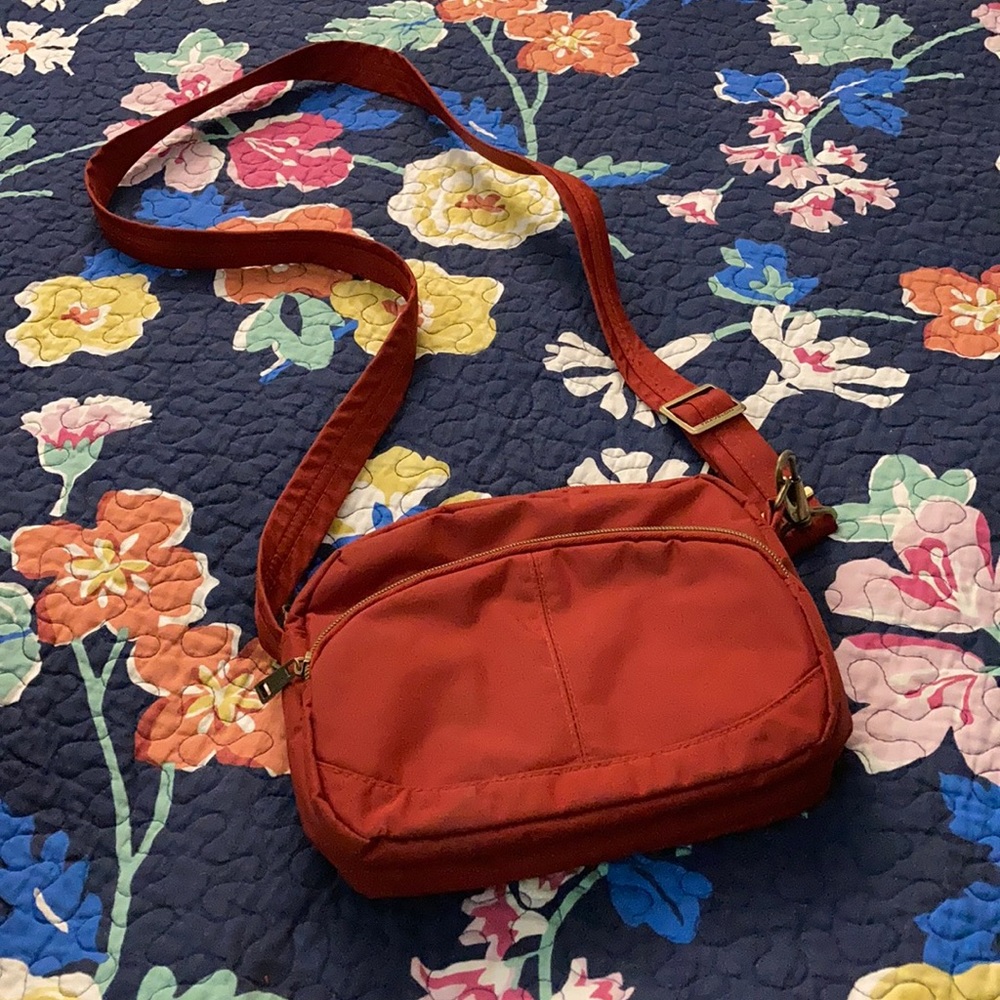 Travelon red sling purse